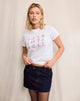 Image of Saki Tee in White with Red Star Signs Print