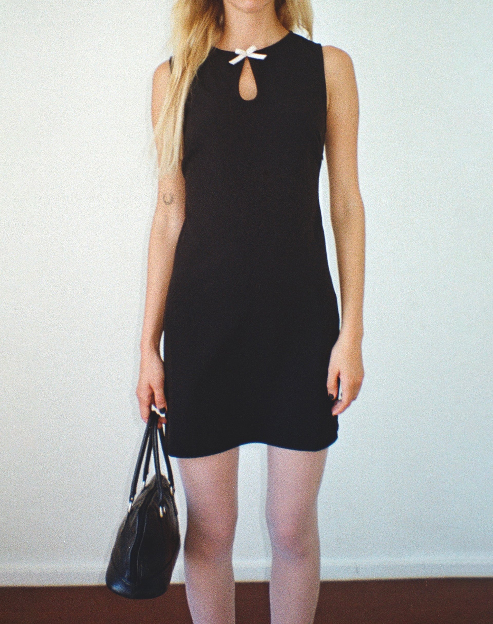 Sleeveless Black Mini Dress with Cream Bow