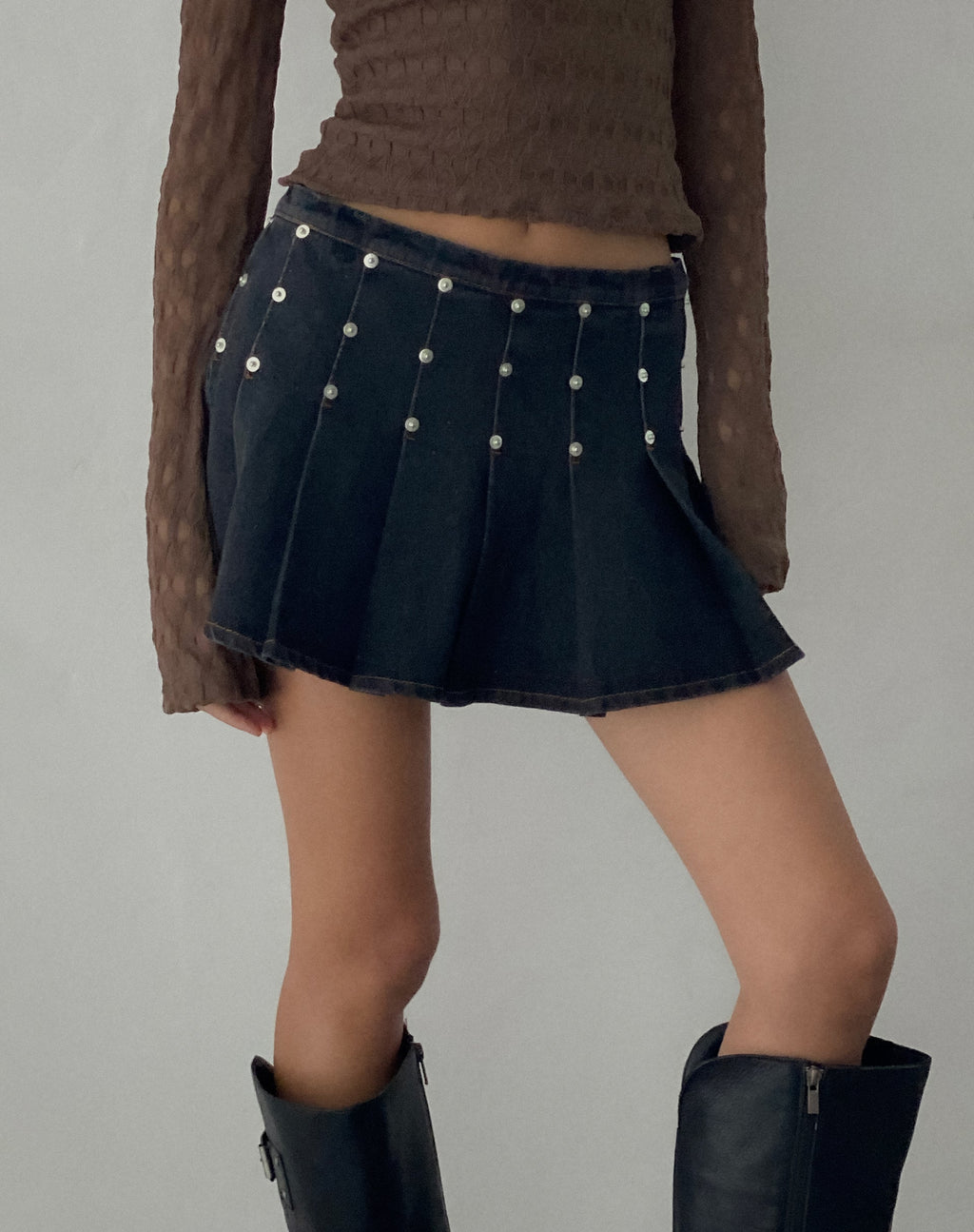 Gatlin Pleated Denim Mini Skirt in Black Wash with Studs