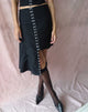 Image of Carlisia Asymmetrical Midi Skirt in Black