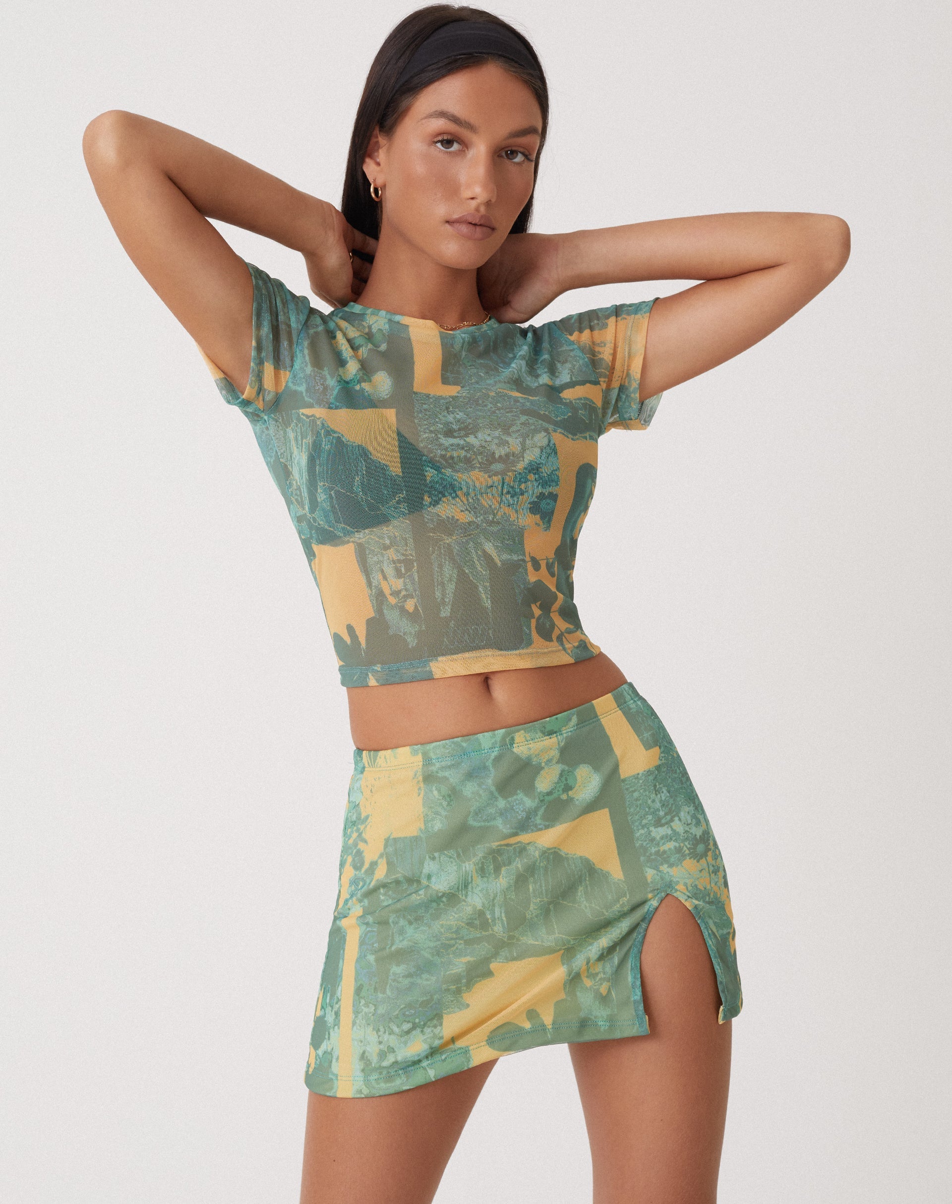 image of MOTEL X OLIVIA NEILL Pelma Mini Skirt in Collage Floral Shadow Green