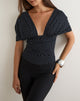 Afbeelding van de Vernia Plunge Batwing-top in zwart jersey met micro-polkadotjes